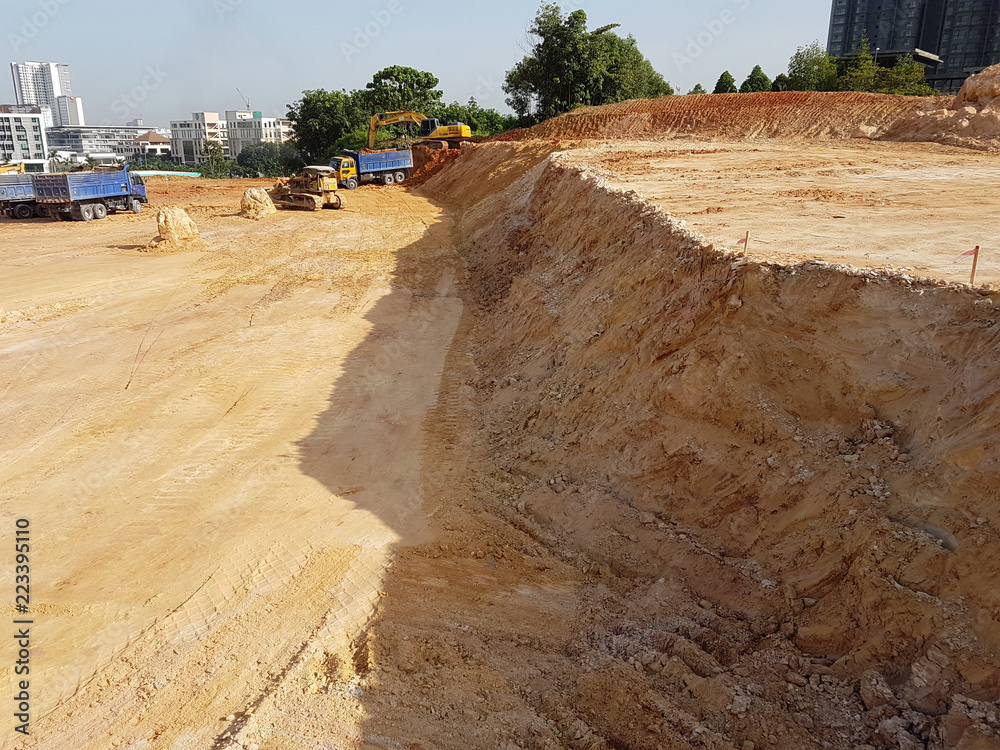 Heavy machinery doing earthwork at the construction site. Works carried ...