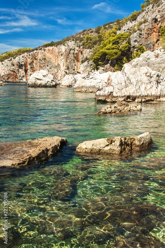 Croatian rocky coastline. Coast of Hvar Island. Greetings from the sea. Sea and rocks in Croatia. Vacation at sea. Quiet place.