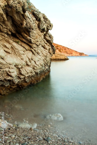 Fototapeta Naklejka Na Ścianę i Meble -  Croatian rocky coastline. Coast of Hvar Island. Greetings from the sea. Sea and rocks in Croatia. Vacation at sea. Quiet place.
