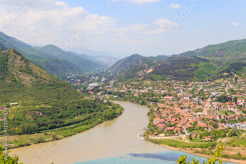 Aerial view on old town Mtskheta and confluence of the rivers Kura and Aragvi in Georgia © olyasolodenko
