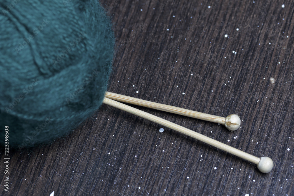 Tangle thread for knitting. Knitting needles are stuck into it. Tangle thread for knitting. Knitting needles are stuck into it.