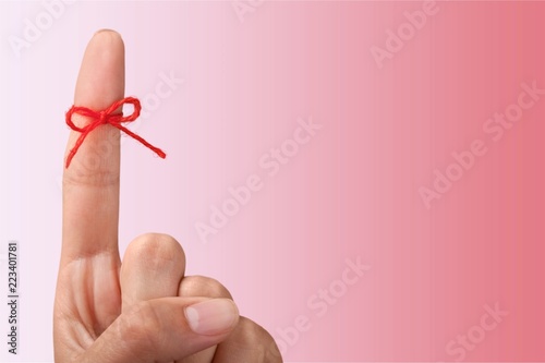 Rope bow on finger pointing up
