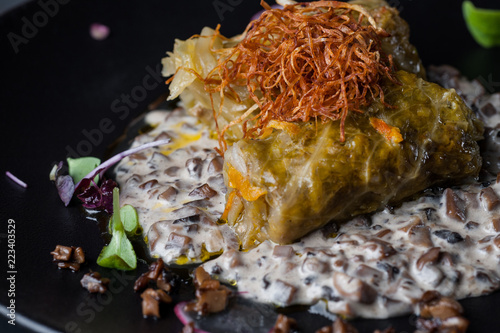 golubtsi Cabbage with rice and meat on a plate of buckwheat and carrots photo