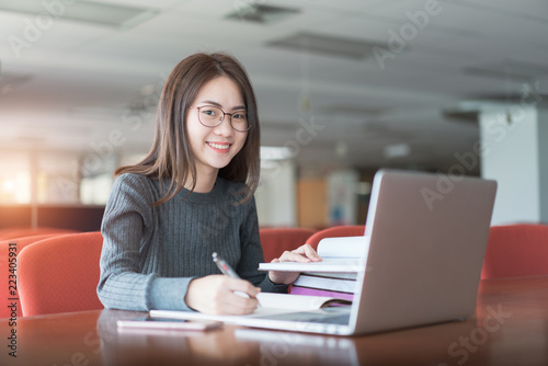 Back to school education knowledge college university concept, Young business woman sitting at table and taking notes in notebook, Learning and education concept