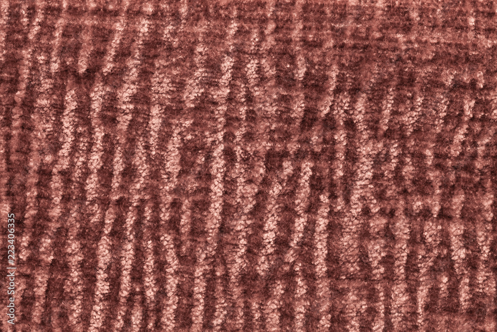 Dark brown fluffy background of soft, fleecy cloth. Texture of plush furry textile, closeup. Dark brown fluffy background of soft, fleecy cloth. Texture of plush furry textile, closeup.