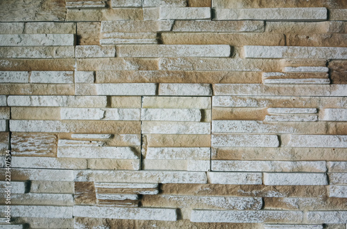 Decorative natural bricks wall background. Beige texture for walls. Interior design ideas.