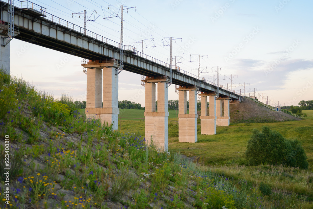 concrete railway bridge across a ravine with pillars concrete railway bridge across a ravine with pillars
