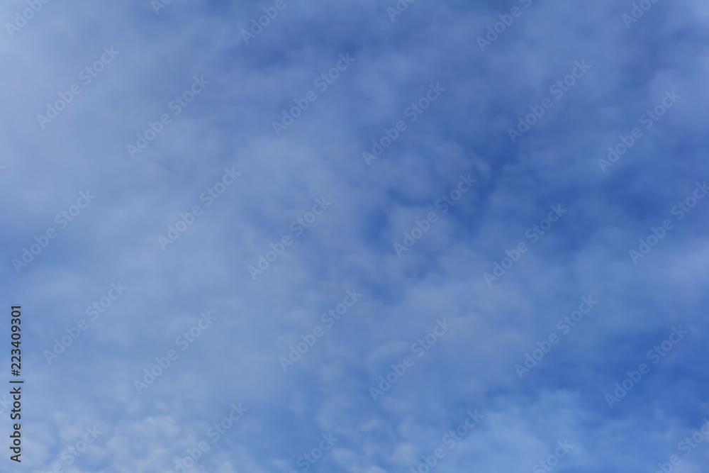 background - blue day sky with white cirro-cumulus clouds