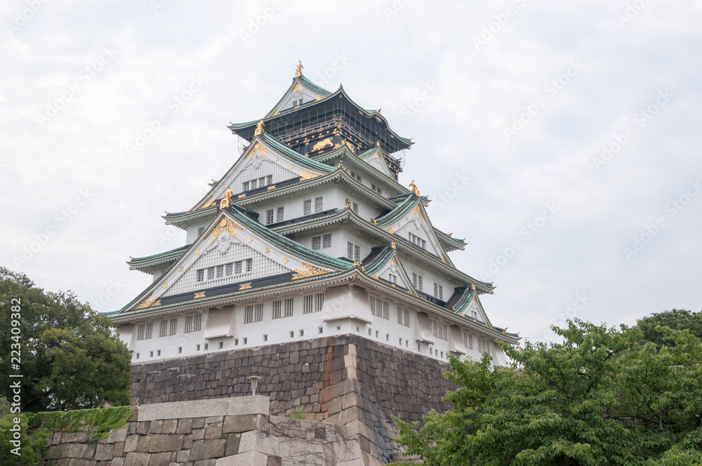 Osaka Castle with dramatic cloudy skies in Osaka, Japan. Osaka Castle with dramatic cloudy skies in Osaka, Japan.
