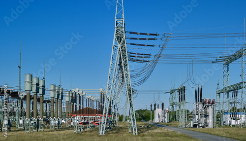 Energy Industry: High and medium voltage substation in East Germany on a sunny morning in July photo