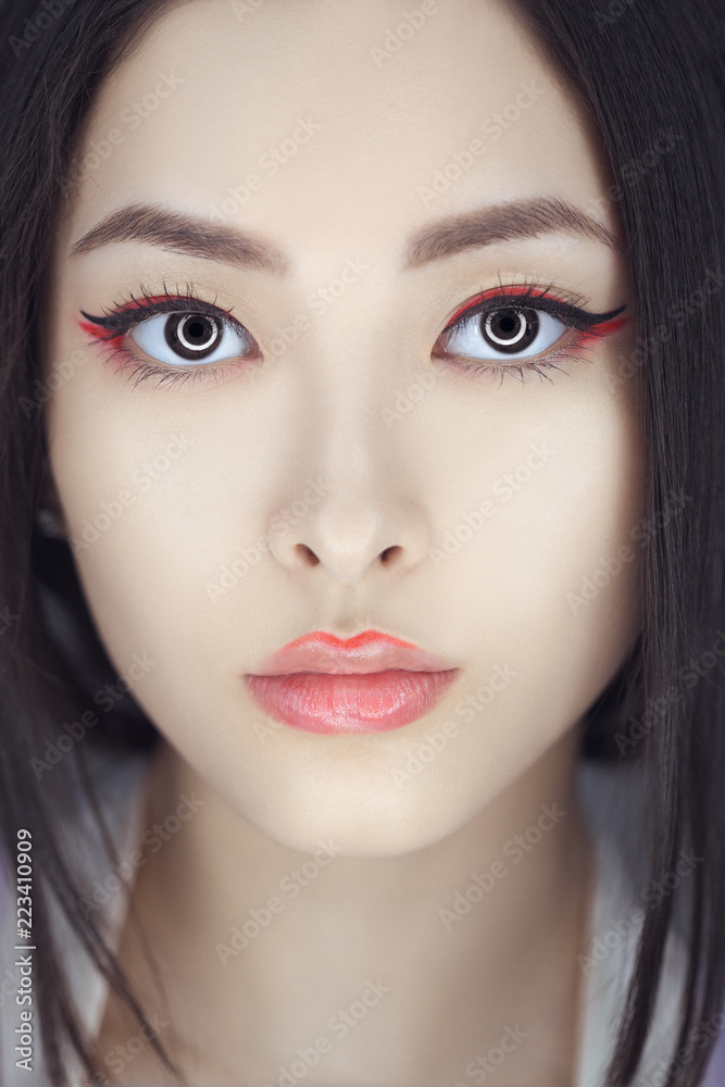 Asian beauty woman skin care close-up. Beautiful young girl with perfect  skin face looking at camera. Isolated on gray background. Tender sensual  mixed race Asian Caucasian female in studio. Fashion foto de