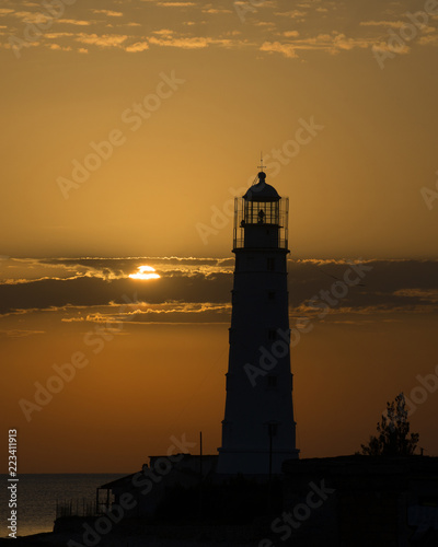 The Tarkhankut lighthouse at sunset. Cape Tarkhankut, south-western cape of the Tarkhankut Peninsula, Crimea