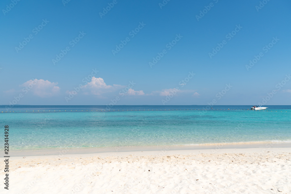 Beautiful white sand on Tropical beach blue water and blue sky Beautiful white sand on Tropical beach blue water and blue sky