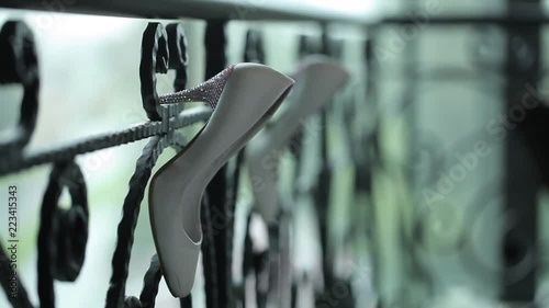 White shoes hang on the railing Macro shot shot glidetrack