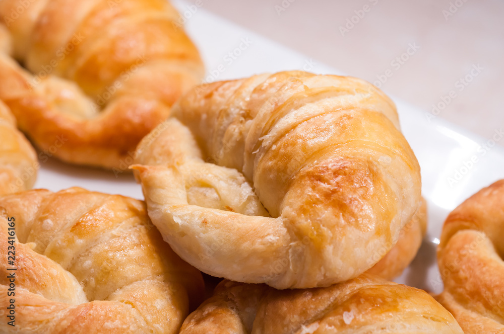 close up of croissants in white dish for breakfast in morning time