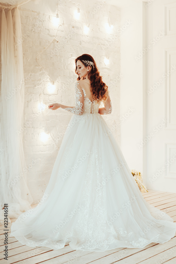 Fototapeta premium beautiful bride in a chic wedding dress