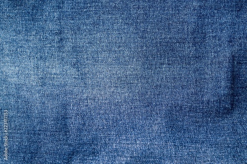 The texture of denim. The background of the blue fabric © Alexandr