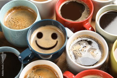 Cups of fresh aromatic coffee on wooden table. Food photography