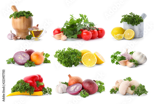 Set with fresh parsley, lemons and vegetables on white background