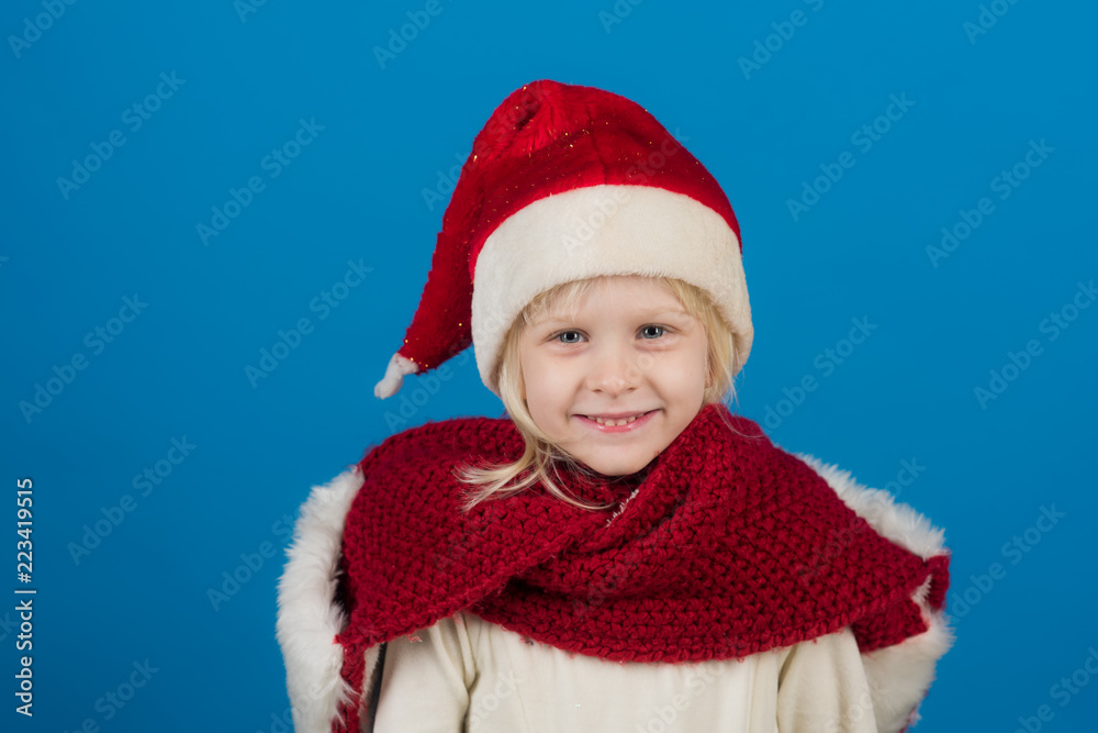 Happy little smiling girl at christmas in santa hat. Happy little smiling girl at christmas in santa hat.