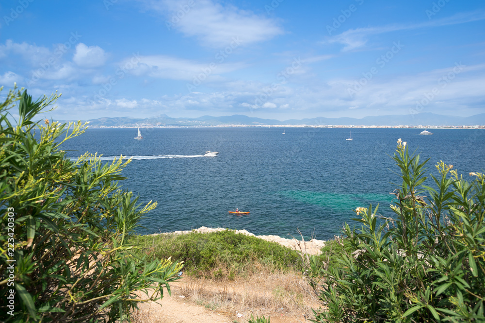 Obraz premium Mallorca coast with sea landscape and motor boat