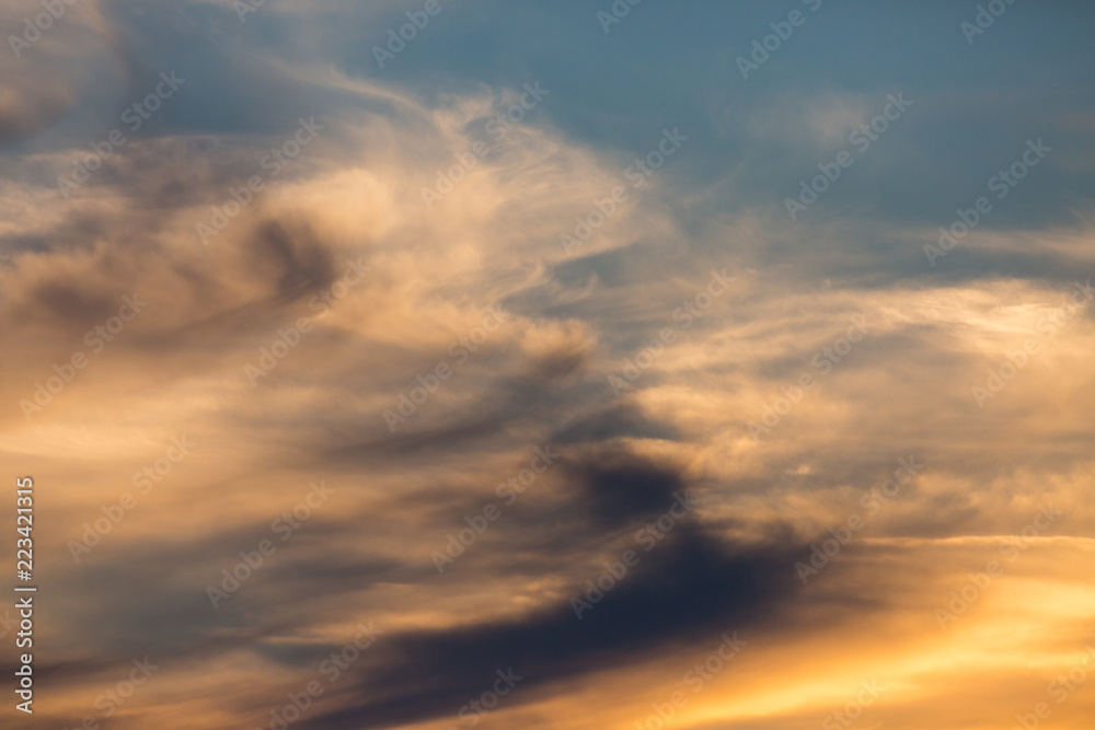 colorful sunset, blue, yellow, orange sky with clouds