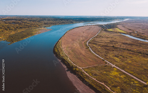 Forest river. Autumn landscape. Taiga forest from aerial view. Vasyugan swamp. Rural landscape © Dmitriy Kandinskiy