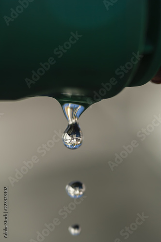 Sequence of water droplets, drains, front view, common problem in old houses, promoting unnecessary expenses, besides being ecologically incorrect.
