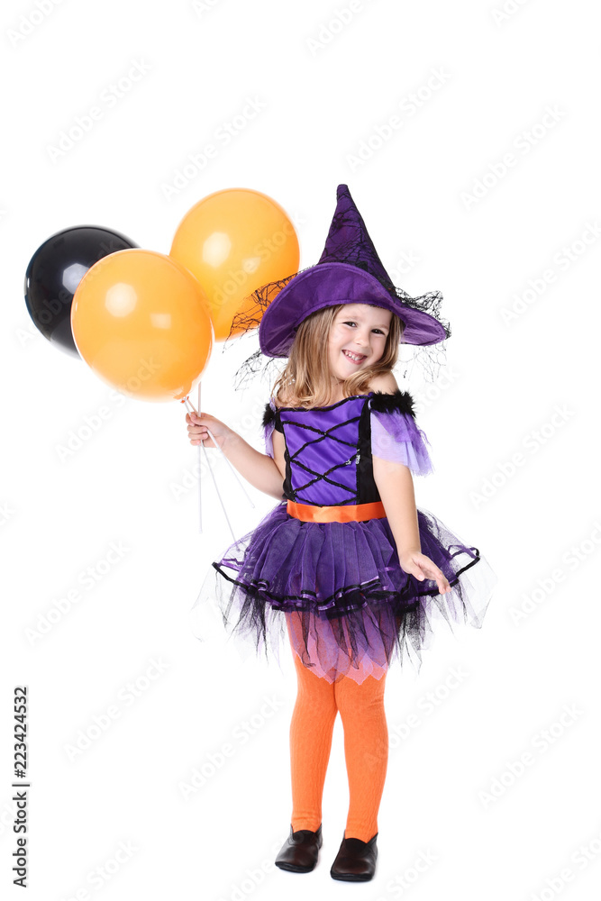 Young girl in halloween costume with balloons on white background