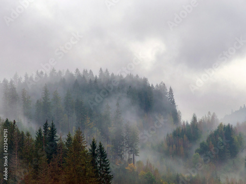 The Carpathian mountains landscape during mist in the autumn season