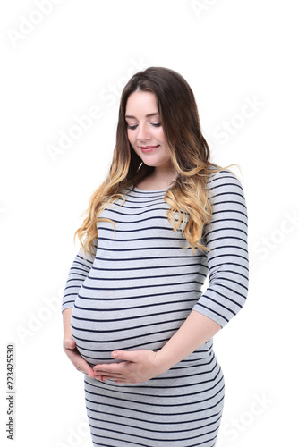 Beautiful pregnant woman in striped dress on white background © 5second