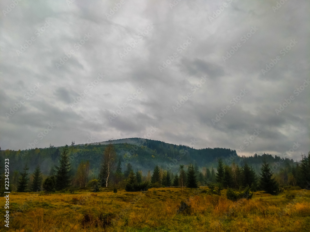 The Carpathian mountains landscape during mist in the autumn season The Carpathian mountains landscape during mist in the autumn season