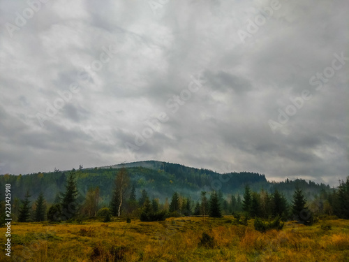 The Carpathian mountains landscape during mist in the autumn season
