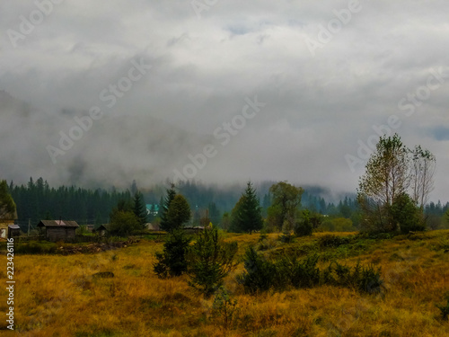 The Carpathian mountains landscape during mist in the autumn season