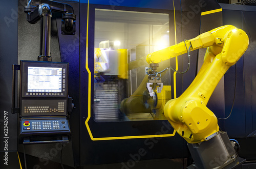 Foto robotic hand machine tool at industrial manufacture factory working in conjuncti