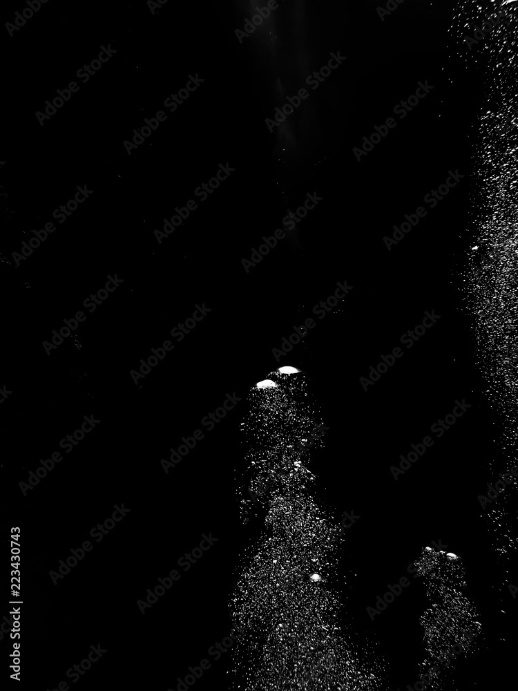 Obraz premium Solid Black Background with White Bubbles Rising