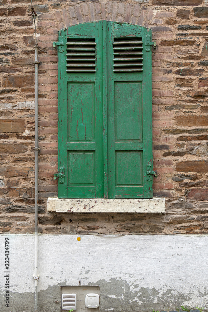 House facade with green windows