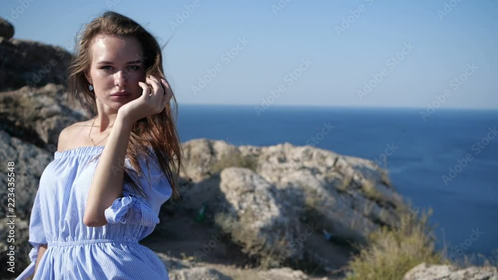 Mountain wind disheveled hair of the model Mountain wind disheveled hair of the model
