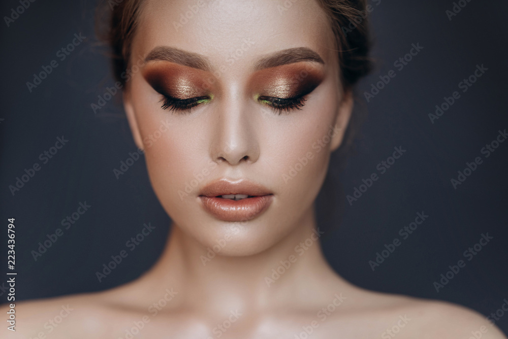 beautiful blonde girl with make-up posing in studio beautiful blonde girl with make-up posing in studio