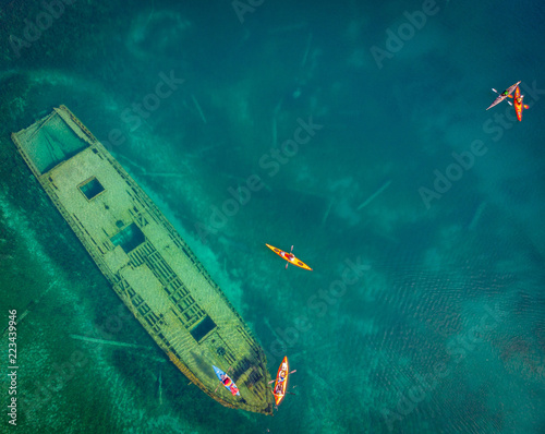 Shipwreck at Tobermory with kayakers, aerial view, Ontario, Canada photo