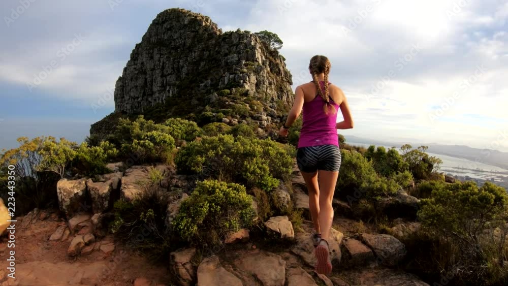 POV, hiker on rocky cliffs in Cape Town