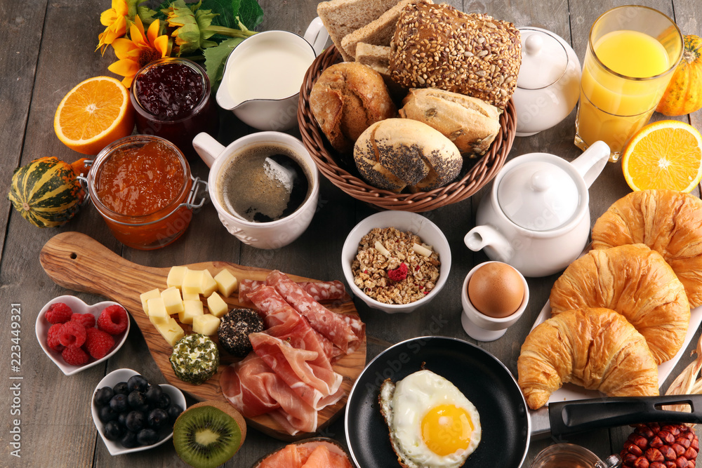breakfast on table with bread buns, croissants, coffe and juice. breakfast on table with bread buns, croissants, coffe and juice.