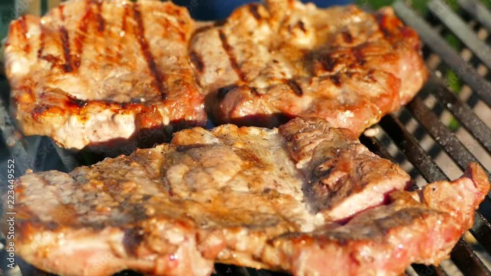 Prepare a steak from raw meat on a barbecue grill. On a picnic, fry a piece of pork. In nature, relax and turn over a fatty fried steak. Prepare a steak from raw meat on a barbecue grill. On a picnic, fry a piece of pork. In nature, relax and turn over a fatty fried steak.