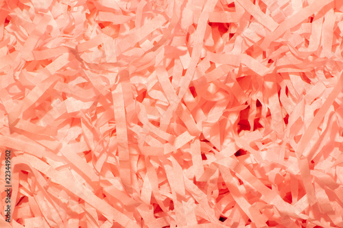 Set of orange thin paper confetti photographed close-up.