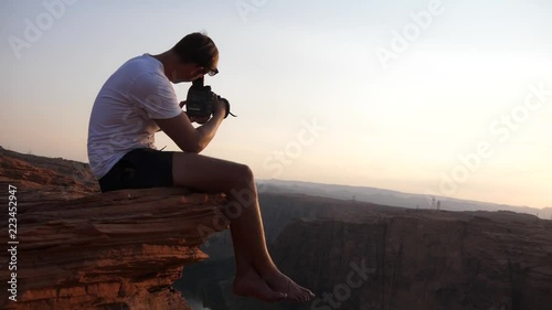 Guy filming scenic view by lake powell in USA photo