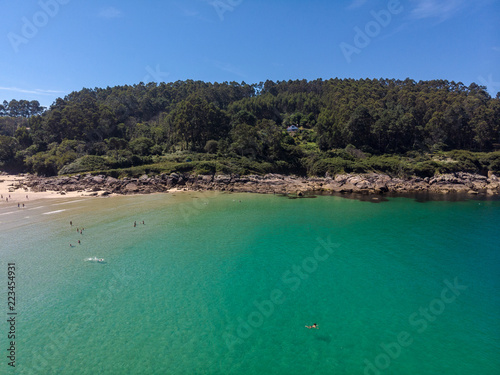 Fototapeta Naklejka Na Ścianę i Meble -   Aerial view of a beach with crystal clear water. Top view of beauty nature landscape with a tropical beach, top view