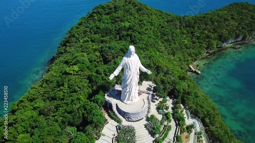 Overlooking Christ the Savior statue atop Pilgrimage Island at Hundred Islands National Park in Philippines photo