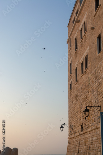 Normann castle in old small city Giovinazzo near Bari, Apulia, Italy in early morning photo