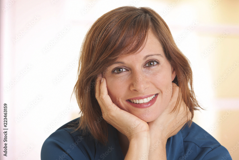 Portrait of young woman with head in hands Portrait of young woman with head in hands