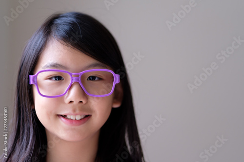 Portrait of Asian teenager girl with big purple glasses